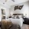 large window brightens bedroom with private bathroom