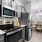 stainless steel appliances in bright kitchen
