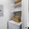 well lit laundry room with washer, dryer and shelving